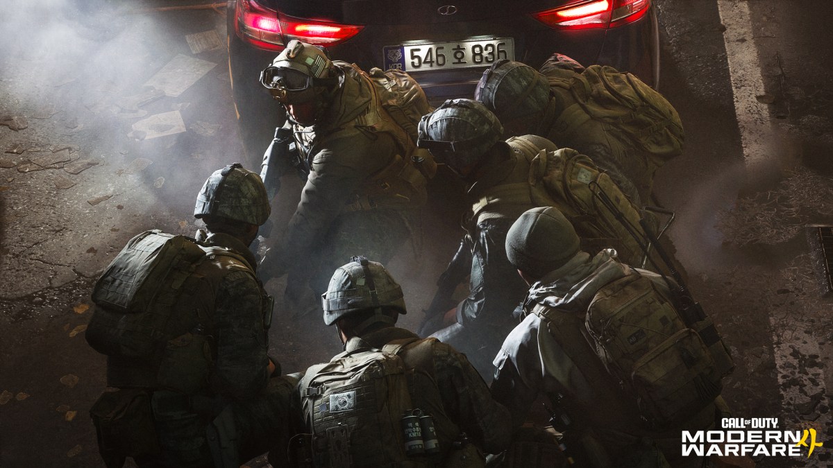 Korean soldiers stacked behind a car during a night operation for a how to redeem modern warfare 4 beta code guide.