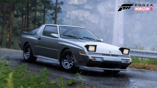Silver 1988 Mitsubishi car with pop-up headlights parked on a wet forest road near a waterfall in Forza Horizon 6 Series 4 Mascot Party.