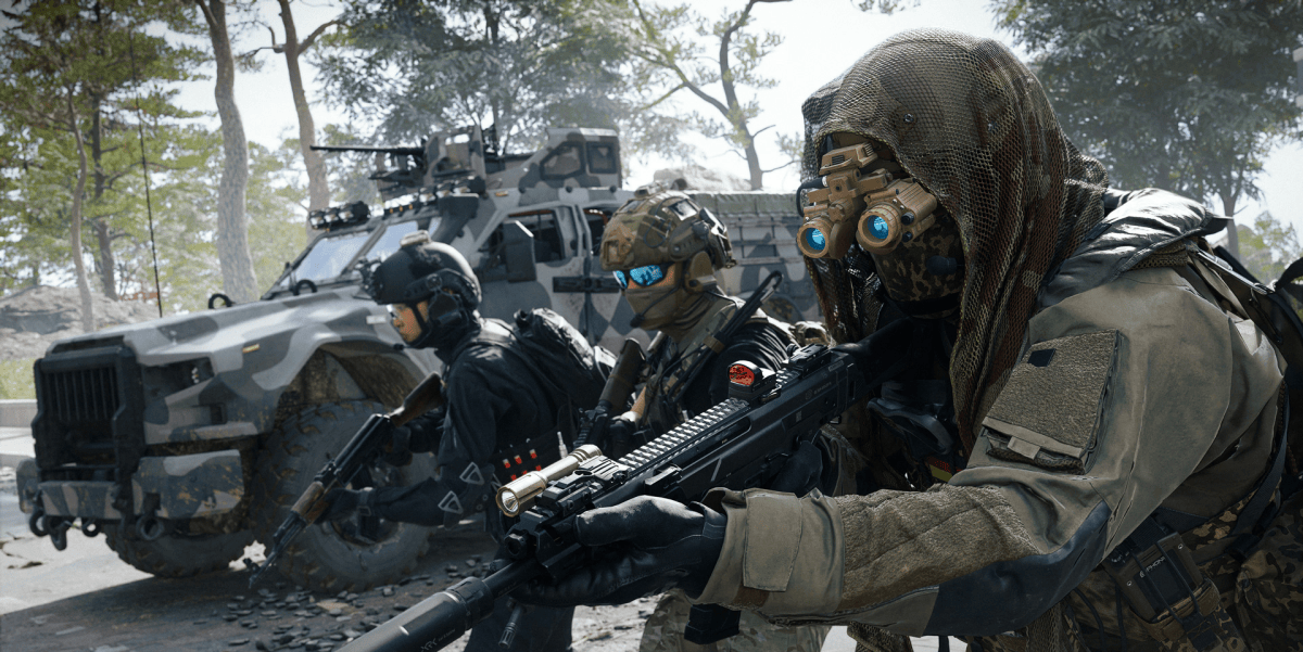 Three custom operators wearing tactical gear and night-vision goggles advance alongside a military vehicle, illustrating loadout options in the Modern Warfare 4 Create-a-Class system.