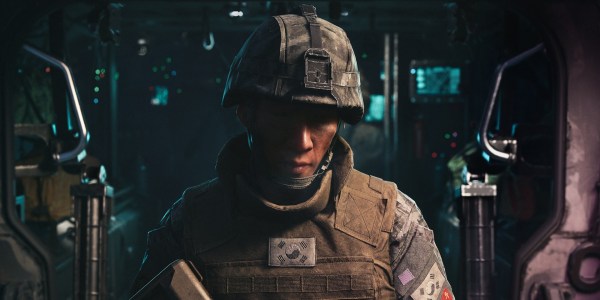 A soldier looking down inside a military vehicle illustrating storage preparation for the estimated GTA 6 file size.
