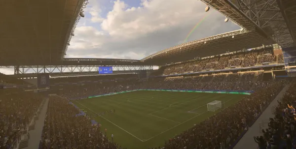 A full stadium in EA FC 27 under a rainbow during a match, representing players completing games to earn fc 27 season end rewards.