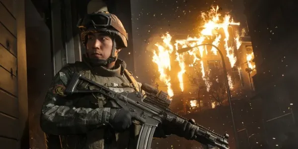 A soldier holding an assault rifle in front of a burning building, showcasing an unlockable character from the MW4 campaign rewards.