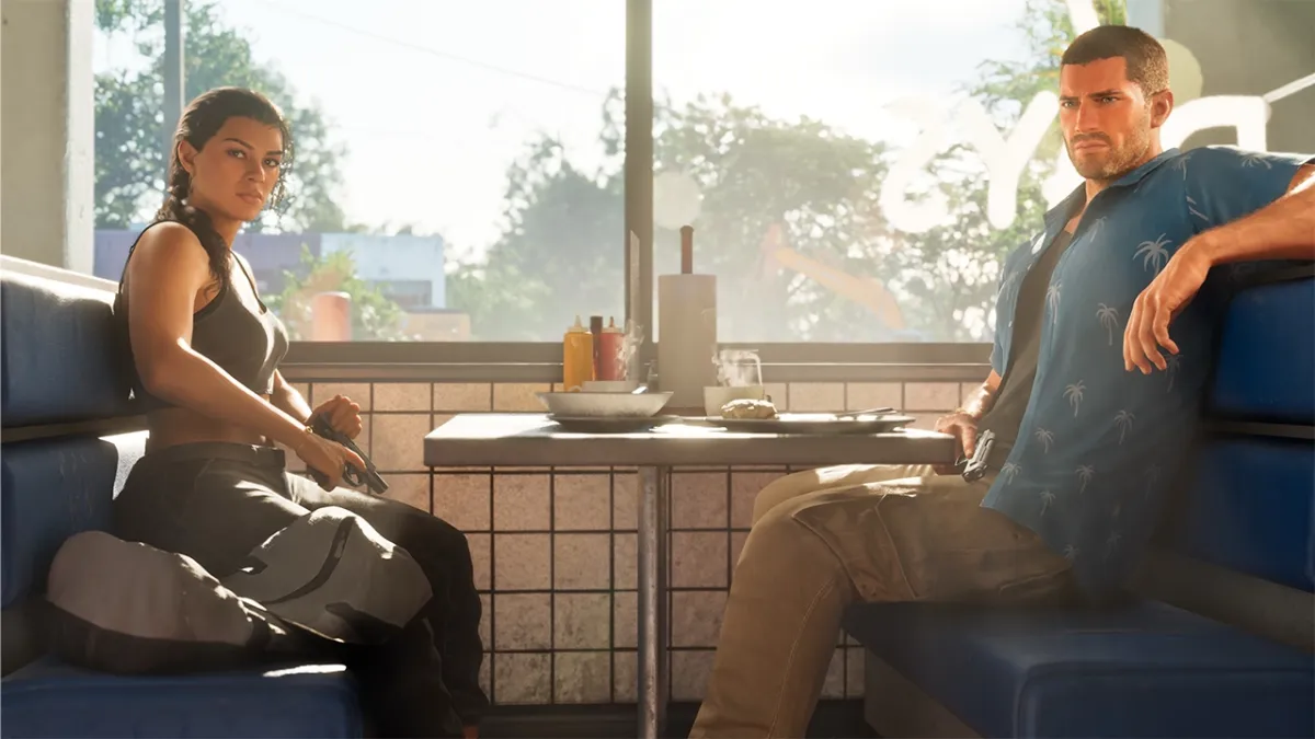 GTA 6 main characters Lucia and Jason sitting in a diner booth holding handguns, featured in a article covering the GTA 6 preload date.